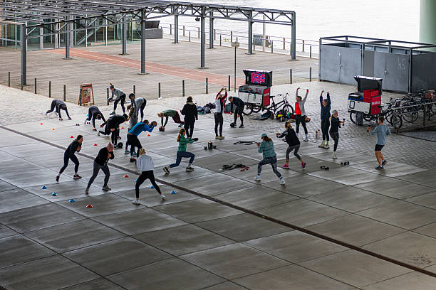Cologne, Germany - October 12, 2024: some people doing sports on a square in Cologne