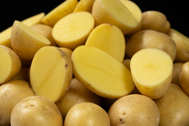 istock Fresh Raw Potatoes Cut In Half Close-Up Macro View. 2233821367