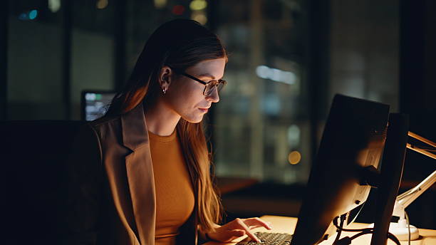 istock Stock market specialist working computer analyzing diagrams night room closeup 2233824529