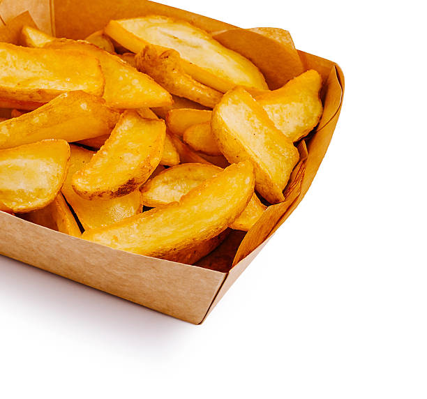 istock Crispy golden potato wedges served in a brown paper container 2233825721