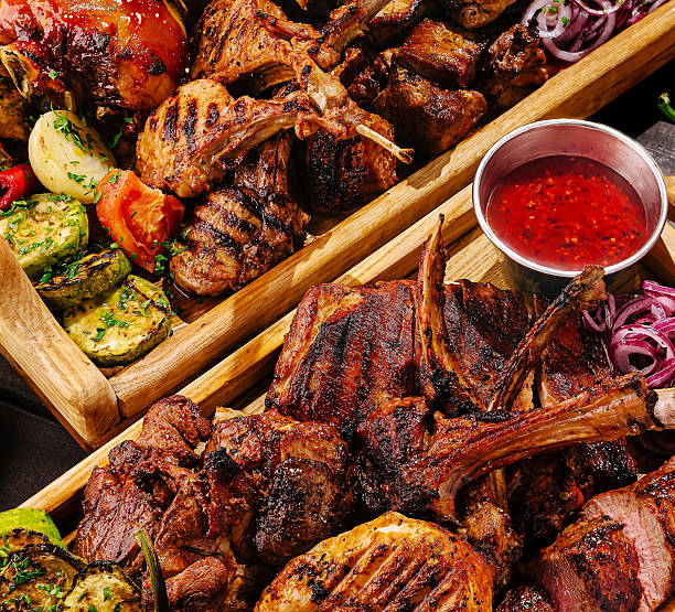 istock Delicious barbecue platter featuring grilled meats and fresh vegetables 2233826034