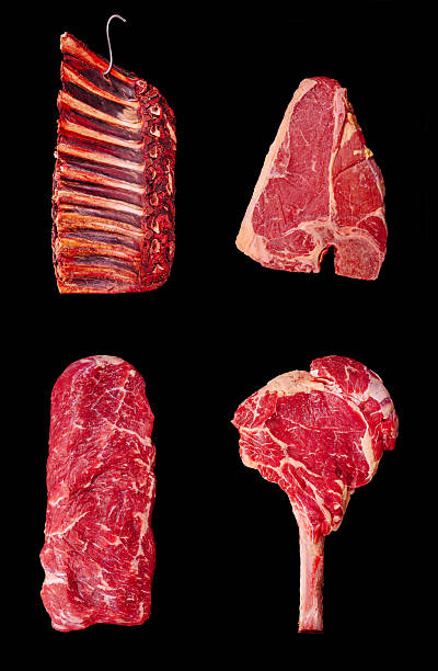 istock Different cuts of fresh meat displayed on a dark background 2233826050