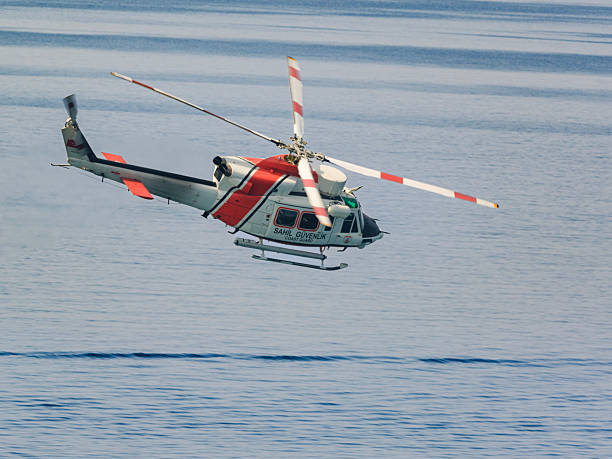 istock Coast Guard Helicopter Flying Over the Sea 2233827297