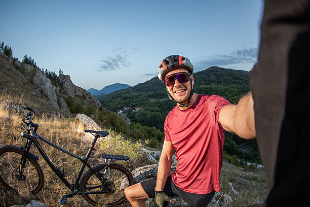 istock Cyclist Capturing a Selfie During a Scenic Mountain Trail Adventure 2233829025
