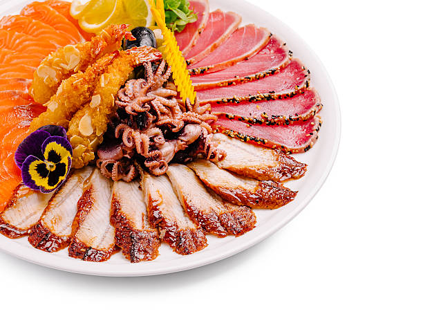 Savoring assorted seafood platter with fresh garnishments
