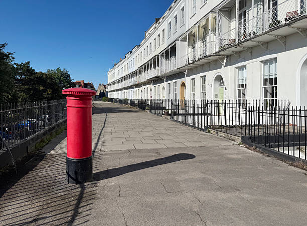 Post box in front of Georgian style apartments on Royal York Crescent in Clifton, Bristol. September 2025