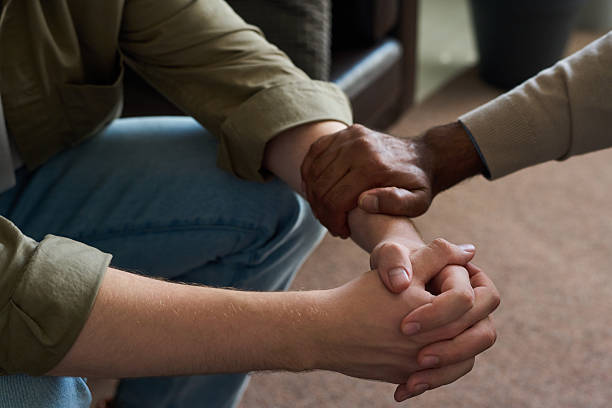 istock Middle Aged Indian Man Offering Support to Caucasian Man by Touch 2233842657