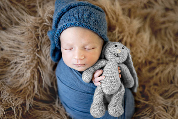 Newborn Baby With Toy At A Photoshoot
