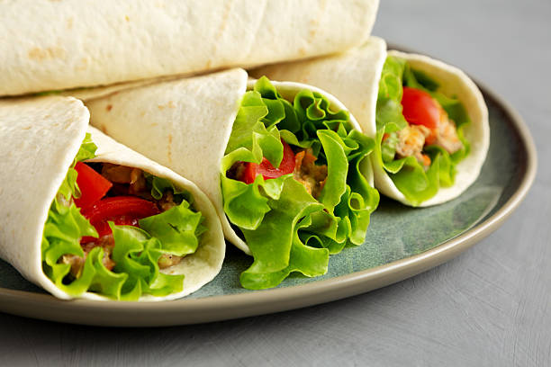 istock Homemade Avocado Tuna Wraps on a Plate , low angle view. Close-up. 2233844438