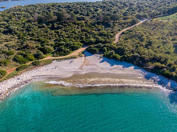 istock Aerial view of serene beach with turquoise waters. 2233845088