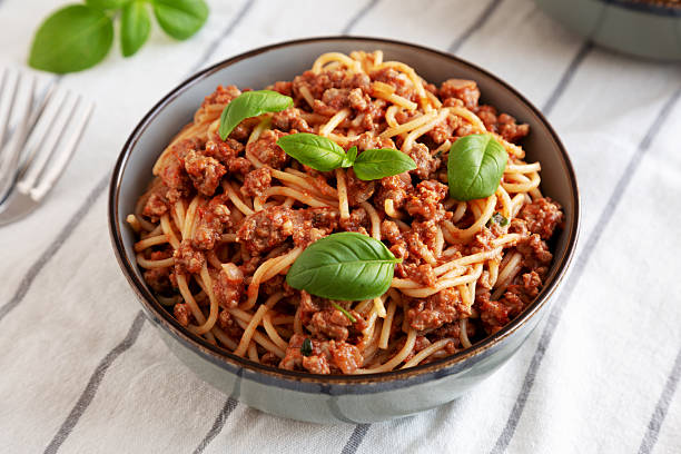 istock Homemade Tomato Basil Sausage Spaghetti in a Bowl, side view. 2233845227