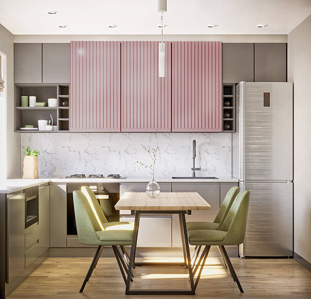 istock 3D visualization of a kitchen interior with pink cabinets, a refrigerator and a dining table with green chairs. 2233846286