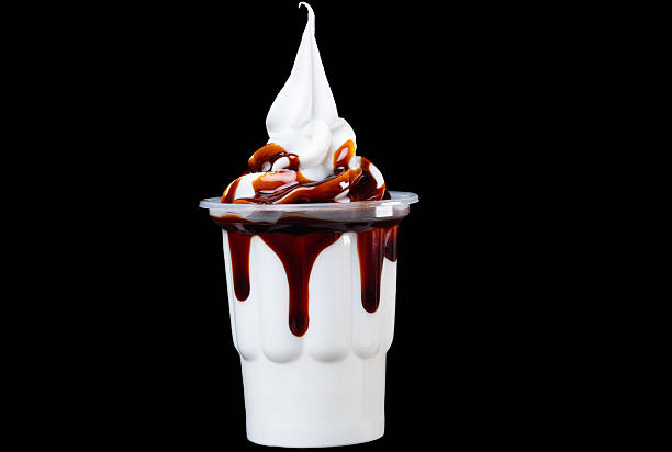 istock ice cream in cups with fruit syrup isolated 2233846394