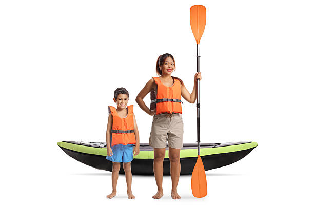 istock Mother and son with a kayak holding a paddle 2233848502