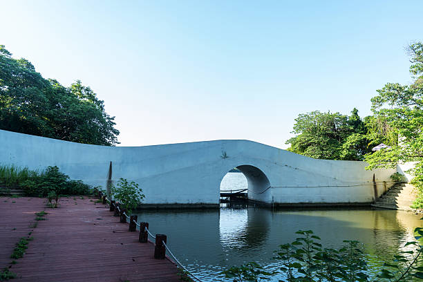 istock stone footbridge in an Asian garden 2233849302