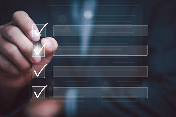 istock Businessman marking digital checklist with transparent interface, symbolizing task management, project planning, productivity, workflow organization, and business efficiency. 2233849452