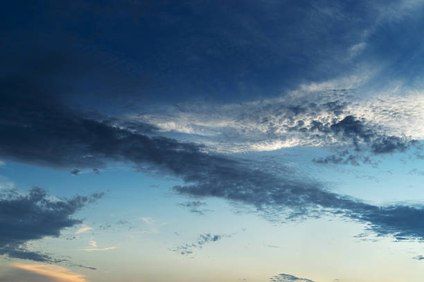 the dark clouds make the sky in black. The rain is coming soon.