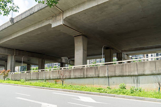 istock Concrete structure and asphalt road space under the overpass in the city 2233849698