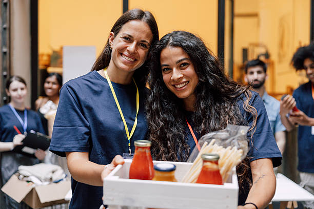 istock Volunteers Packing Donations for Food Assistance Programs 2233850235