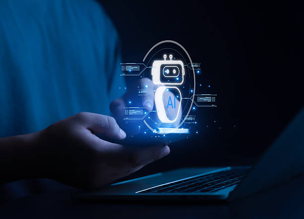 istock Hand holding smartphone with glowing AI chatbot icon, symbolizing artificial intelligence, virtual assistant, automation, digital technology, customer service, and modern innovation concept. 2233850534