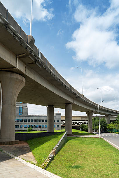 istock Looking up at a Large Interstate Highway Overpass and Blue Sky 2233850683