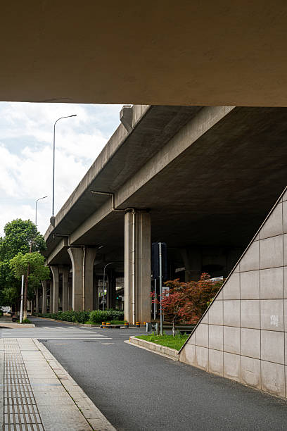 istock Concrete structure and asphalt road space under the overpass in the city 2233850712