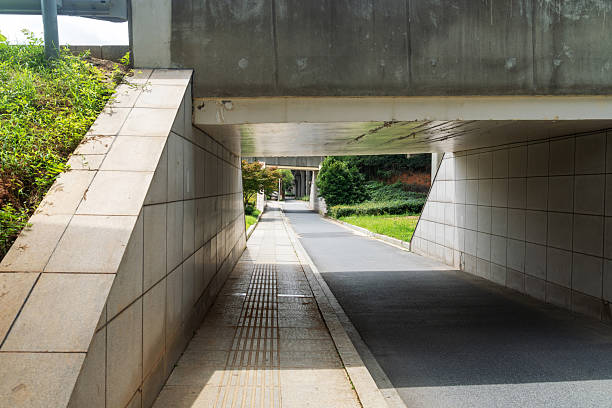 istock Concrete structure and asphalt road space under the overpass in the city 2233850720