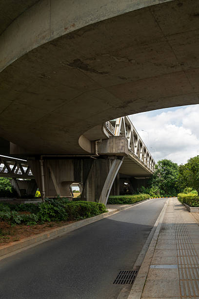 istock Concrete structure and asphalt road space under the overpass in the city 2233850905