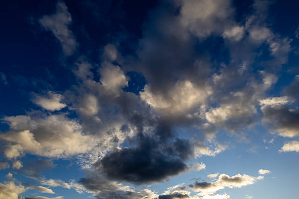 istock White and dark clouds across blue sky, Wirral, Merseyside, England, Britain 2233851436