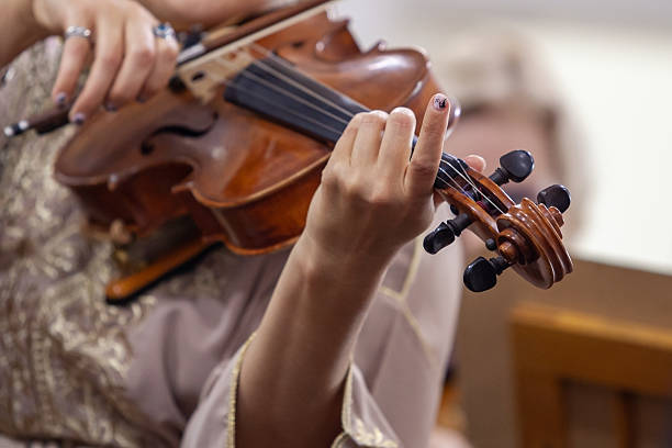 istock Hands of a woman playing the viola 2233852749