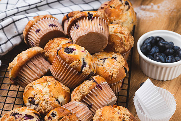 istock Blueberry muffins on a rustic table in a mold 2233856691
