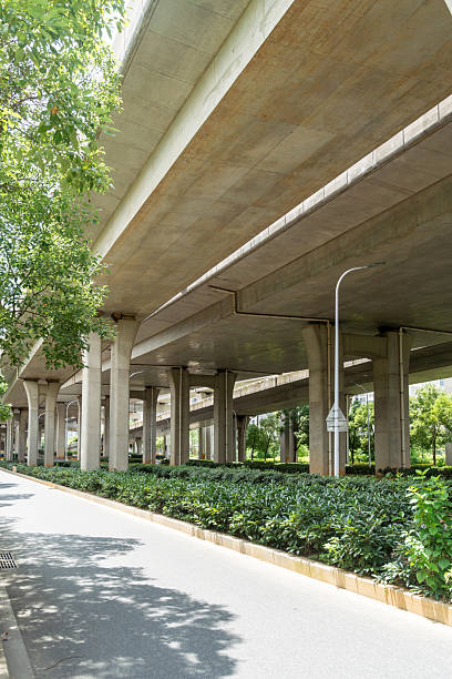 istock Concrete structure and asphalt road space under the overpass in the city 2233860339