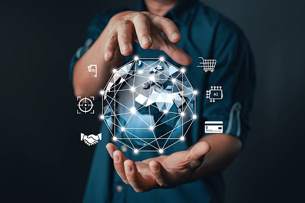 istock businessman hold a glowing digital globe with interconnected icons representing AI, finance, e-commerce, targeting, handshake, and global connectivity, modern digital transformation and technology. 2233866547