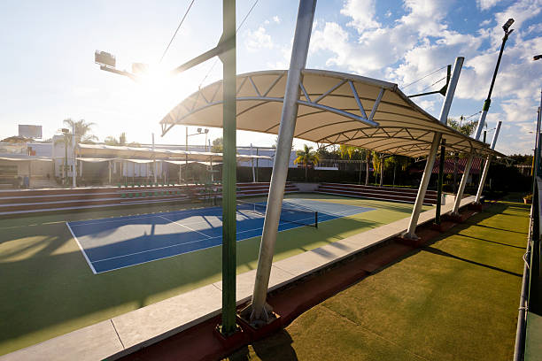 Professional hard tennis courts in perfect condition, protected by a dome.