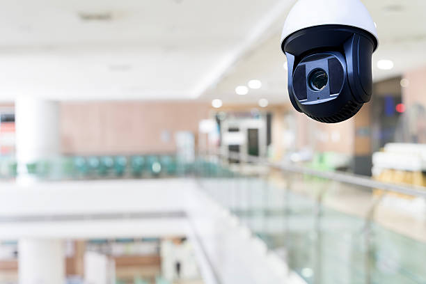 istock Surveillance security camera monitoring modern building interior for safety, technology, and protection 2233868016