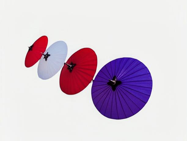 Umbrella on red background