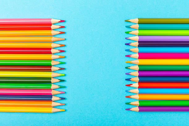 istock Colored pencils on a bright colored background. Equipment for coloring. Stationery for creativity.Back to school. Flatlay. Children's Creativity and Education. Rainbow.Space for text. Copy space. 2233869687