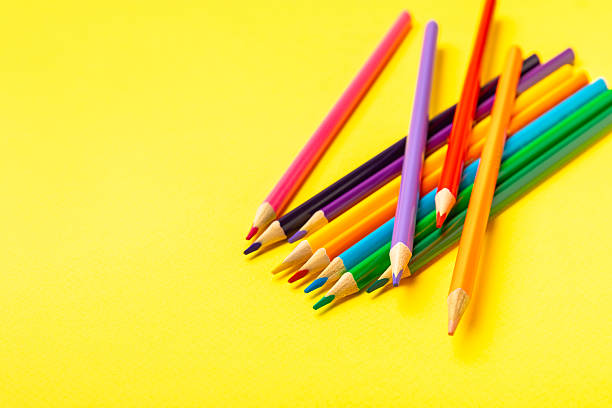 istock Colored pencils on a bright colored background. Equipment for coloring. Stationery for creativity.Back to school. Flatlay. Children's Creativity and Education. Rainbow.Space for text. Copy space. 2233869710
