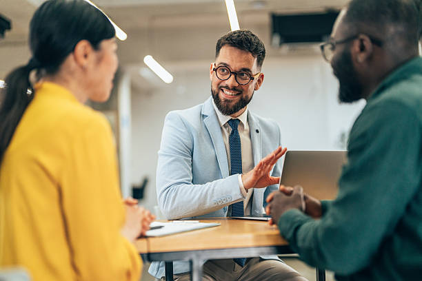 istock Business professional leading team meeting in modern office 2233869737