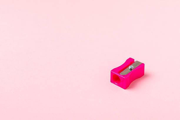 istock Pencil sharpener on bright colored background. Pencil and pencil shavings. Stationery. School supplies. School products. Flat lay. Place for text. copy space. 2233869890