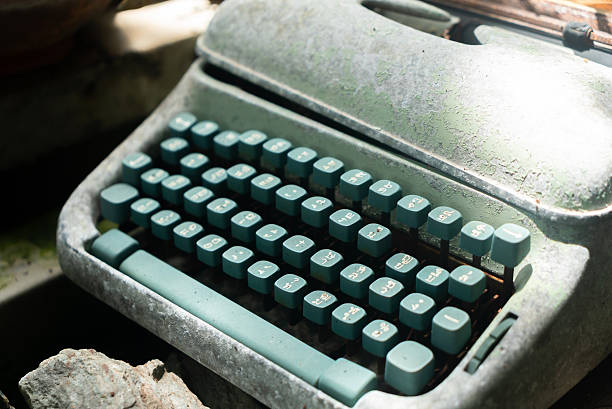 istock Vintage Green Typewriter on Dusty Surface 2233872760