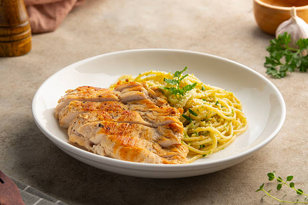 istock Grilled Chicken breast with spaghetti broccoli pesto sauce 2233875747