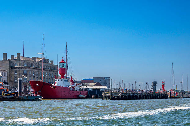 Several fishermen minding their fishing rods on the Ha’penny Pier in Harwich, Essex, Eastern England. The large building to the left was once an hotel and the red lightship, also on the left, was once the home of pirate radio ‘Radio Caroline’ in the North Sea! ‘Radio Mi Amigo’ now broadcasts (legally!) from LV18 (Lightvessel 18) in Harwich Harbour. Interestingly, long before her pirate days, she was a three-masted schooner called ‘Margarethe’.