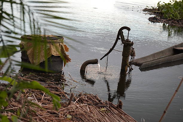 istock Traditional Indian Hand Pump in Rural Pond 2233885393