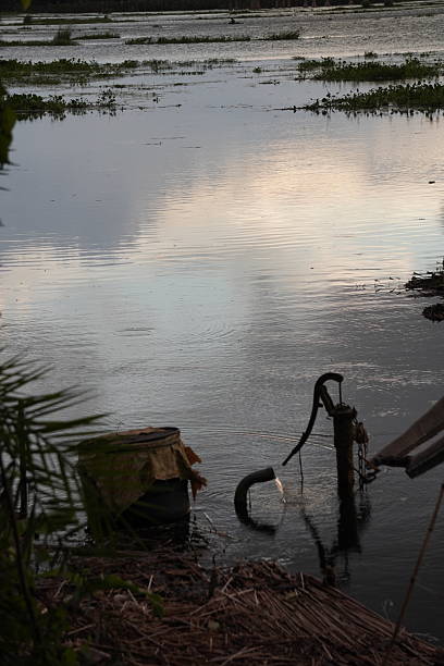 istock Traditional Indian Hand Pump Pond Reflection 2233885474