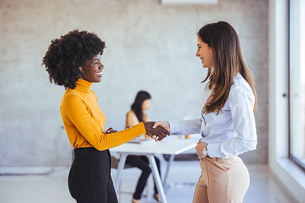 istock Two Professionals Shaking Hands During a Business Meeting in a Modern Office 2233887160