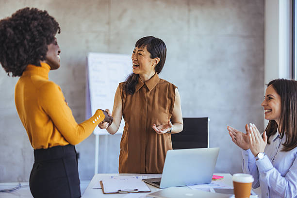 istock Diverse Team Celebrating Success During Business Meeting in Modern Workspace 2233887183