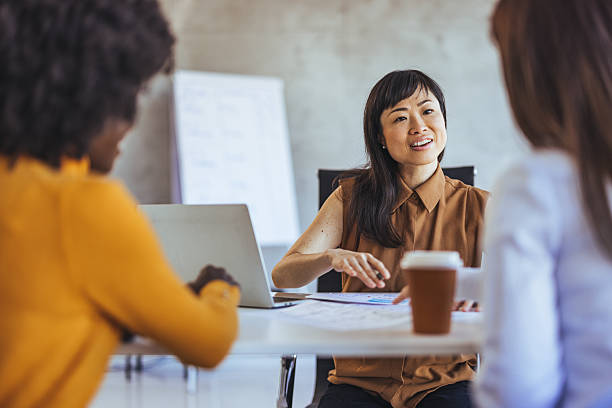 istock Professional Business Meeting With Colleagues Discussing Plans in Modern Office Setting 2233887191