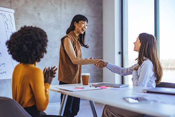 istock Team Members in a Positive Workplace Interaction During a Business Meeting 2233887220