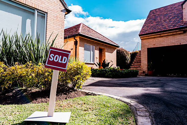 House with sold sign